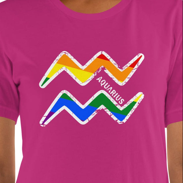 Rainbow Aquarius zodiac sign graphic tee with distressed water bearer waves glyph on a berry pink unisex Bella Canvas shirt by Guided Gear.